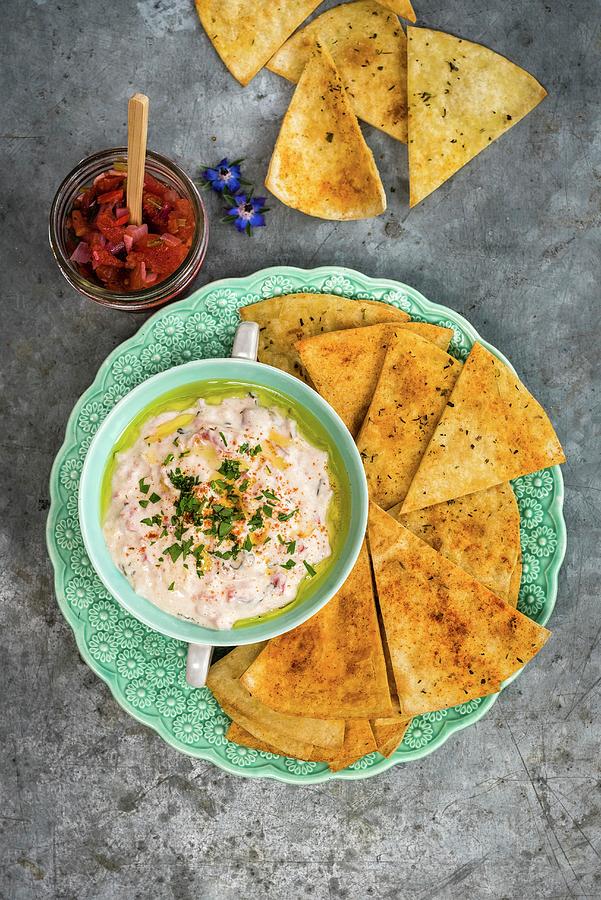 Tortilla Chips With A Cheese Dip And Salsa Photograph by Lucy Parissi