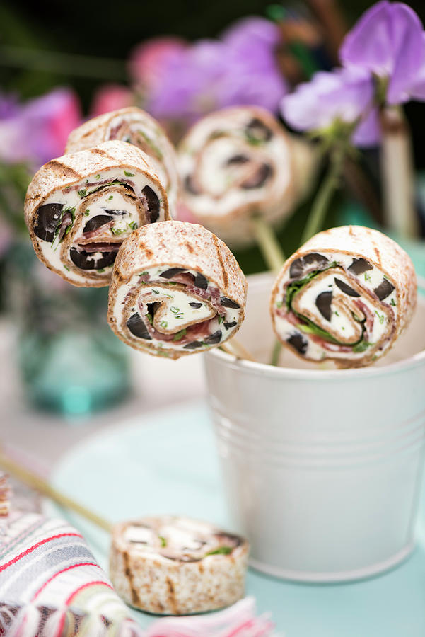Tortilla Pinwheel Lollies With Cream Cheese, Salami With Olives For A School Lunch Photograph by Winfried Heinze