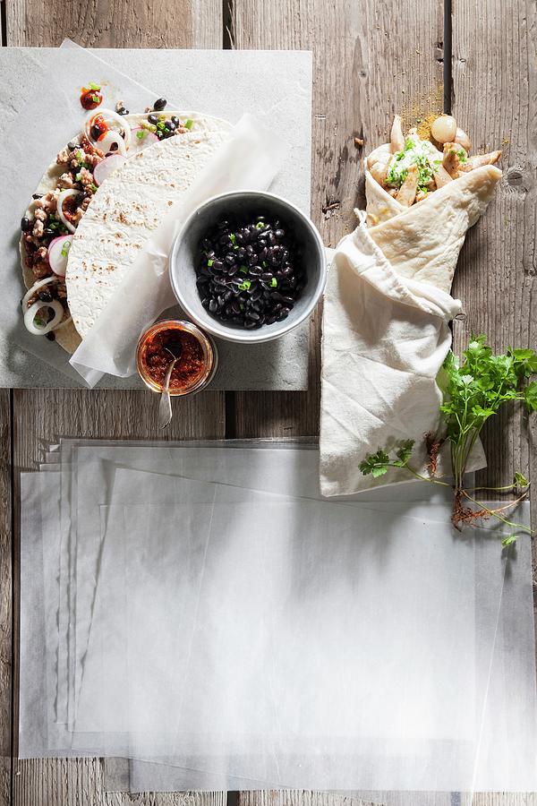 Tortilla Wraps With Minced Turkey And Beans Next To Shawarma With Green Tahini Photograph by Danny Lerner