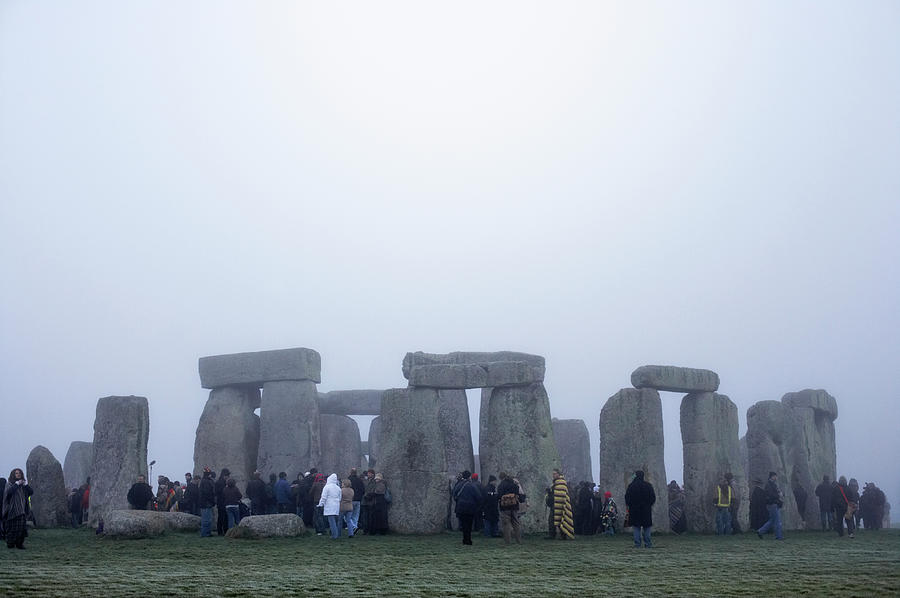 Tourist At Stonehenge In Winter Photograph by Tim Robberts