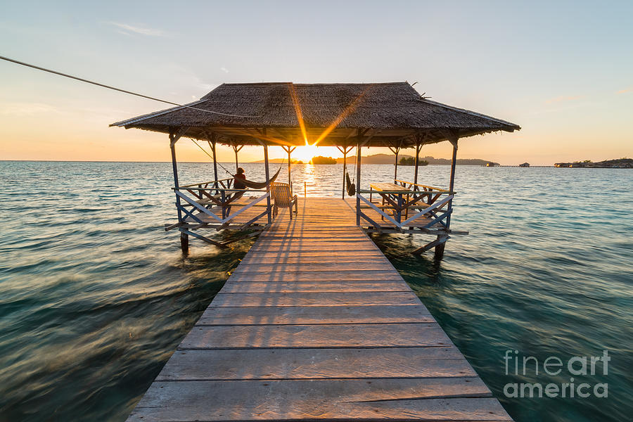 Dusk Photograph - Tourist Sitting On Wooden Jetty While by Fabio Lamanna Dusk Photograph - Tourist Sitting On Wooden Jetty While by Fabio Lamanna