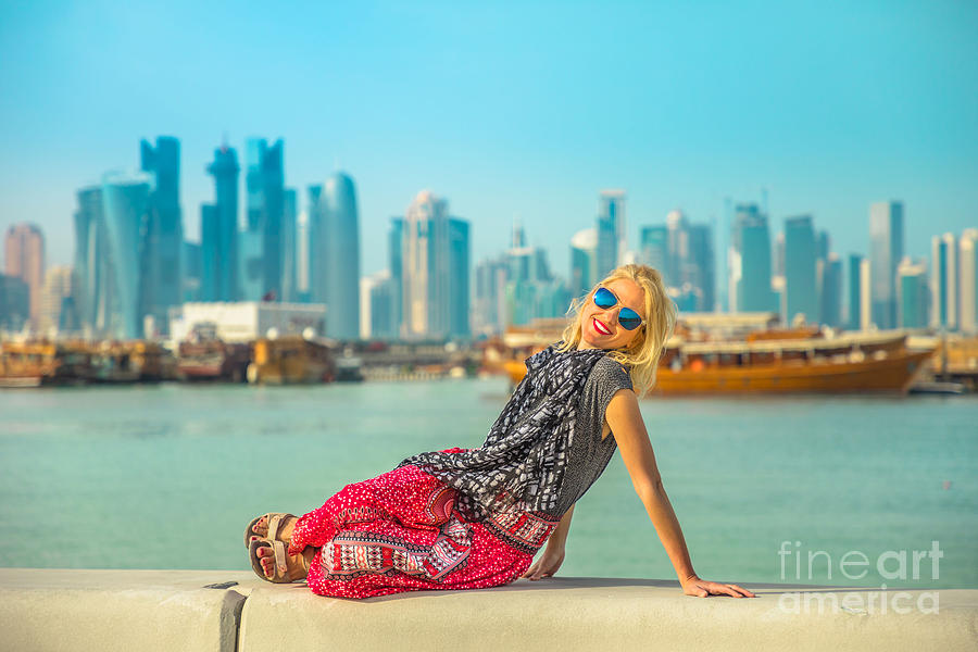 Tourist woman at Doha Corniche Photograph by Benny Marty