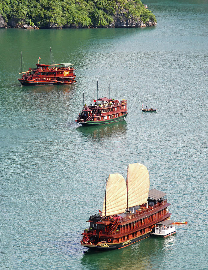 Tourist wooden Boats at Halong Bay Vietnam Photograph by Michalakis Ppalis