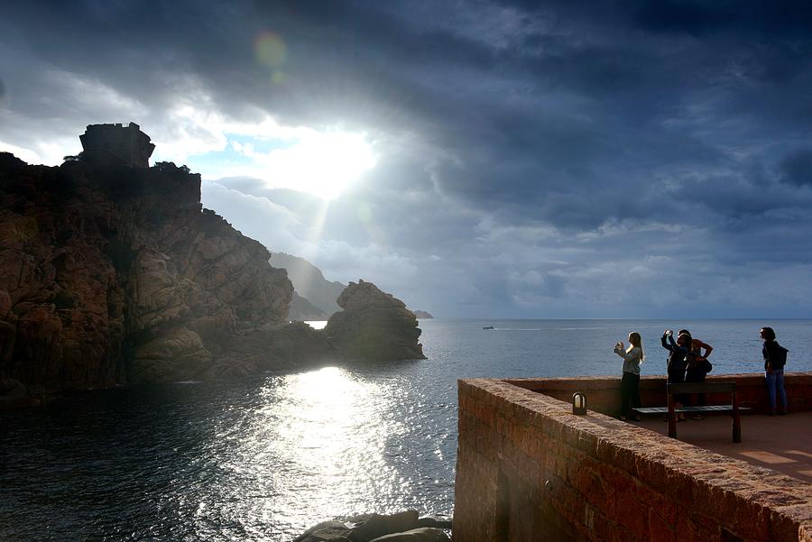 Tourists Marvel At The Sunset At Porto On The Gulf Of Porto, Western Corsica, France Photograph by Thomas Stankiewicz