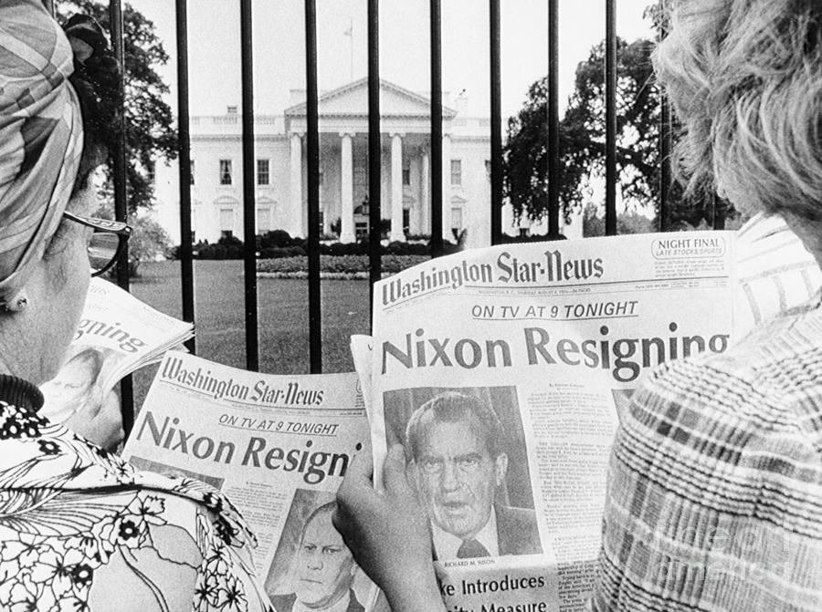 Tourists Reading Nixon Resignation Photograph by Bettmann