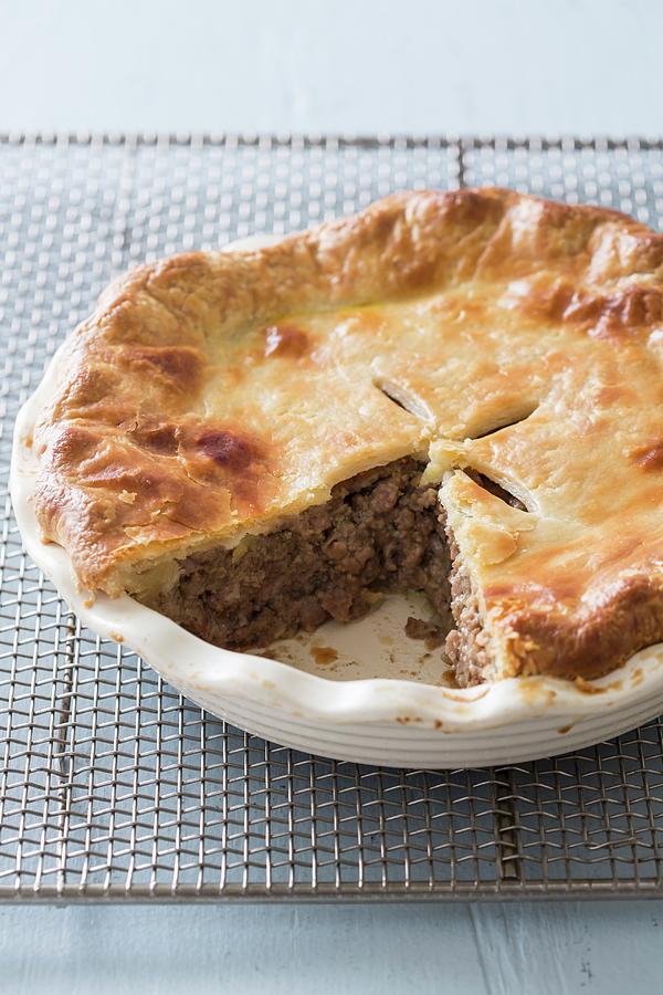 Cake Photograph - Tourtiere french-canadian Meat Pie In A Baking Dish On A Wire Rack With A Slice Cut Out by Keller & Keller Photography
