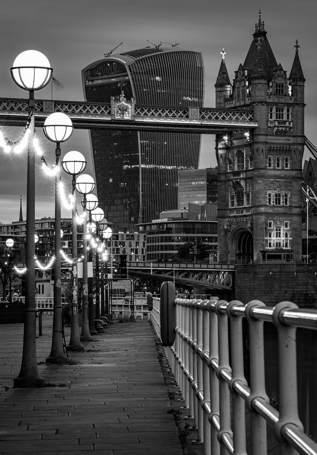 London Photograph - Tower bridge in London seen at night. by George Afostovremea