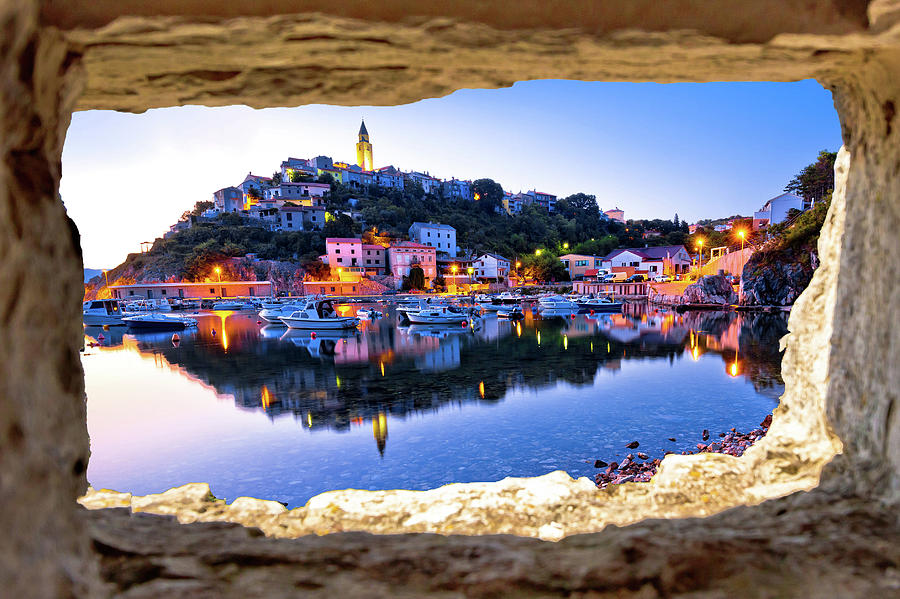 Town of Vrbnik harbor view morning glow view through stone windo Photograph by Brch Photography