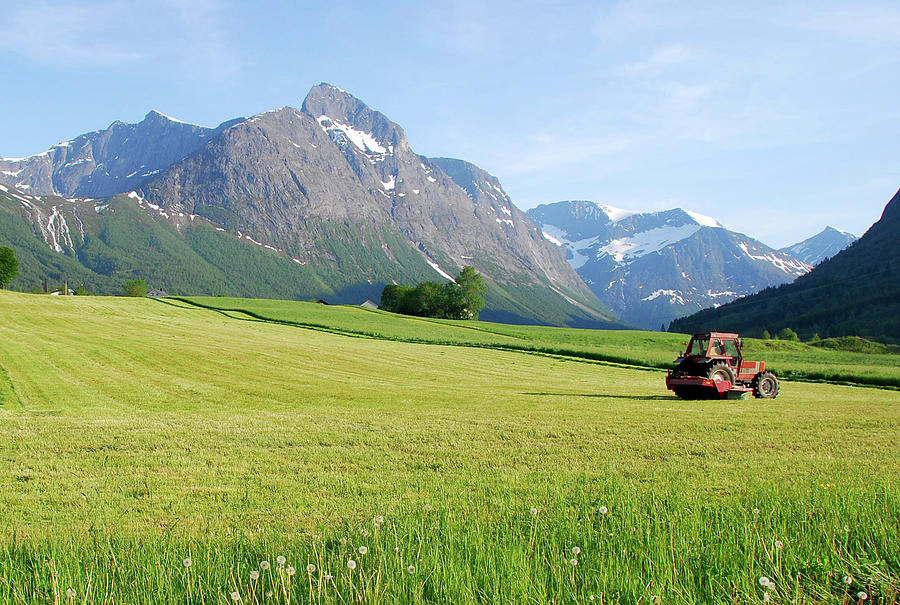 Tractor And Montains In Norway Photograph by Jean-philippe Tournut