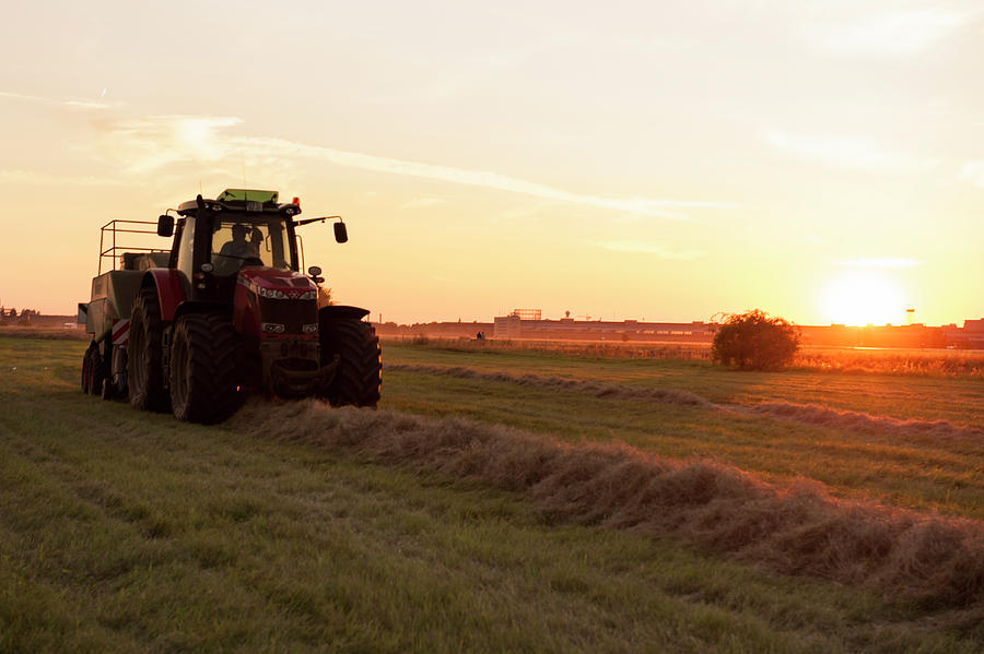 Tractor On Tempelhof Field Garden At Sunset In Berlin, Germany Photograph by Lukas Larsson Jalag