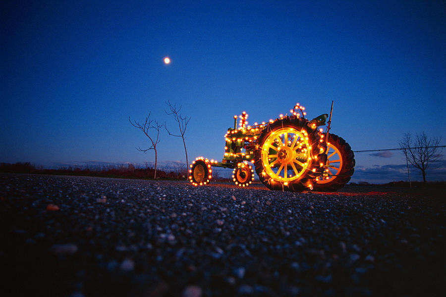 Tractor With Holiday Lights At Farm by Pete Turner