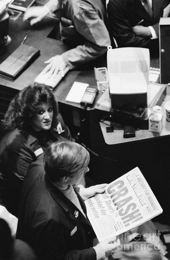 Trader On Floor Reads About Black Monday Photograph by Bettmann