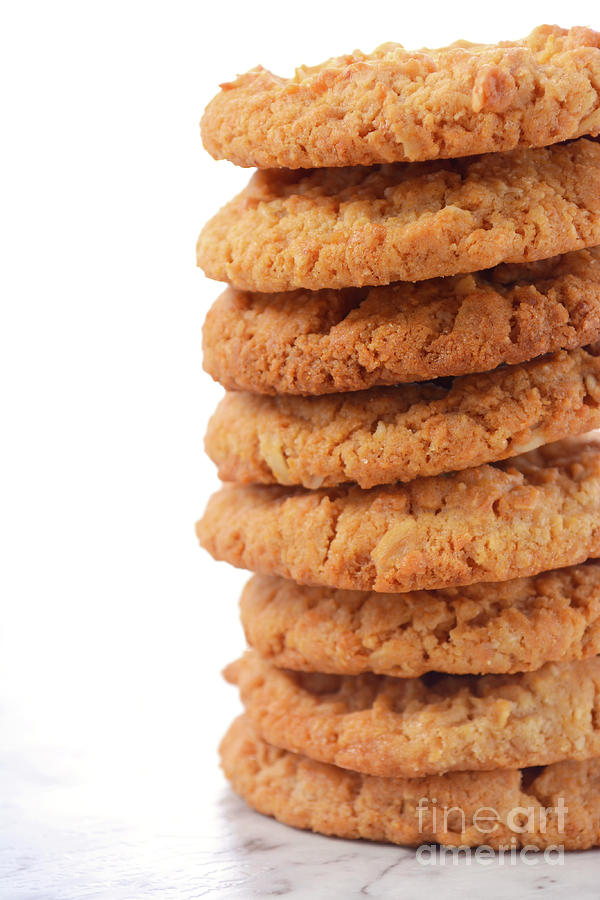 Traditional ANZAC Biscuits on White Background Photograph by Milleflore Images