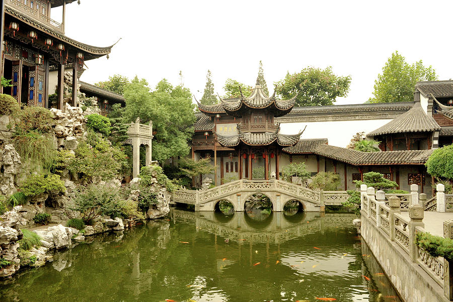 Traditional Chinese Garden With Fish Pool, Stone Bridge And Pavilions ...
