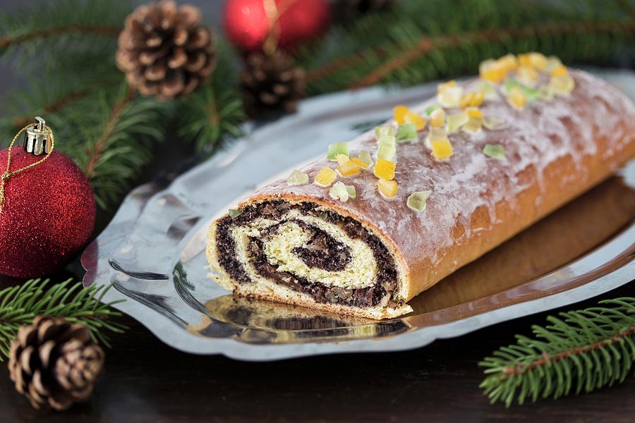 Traditional Poppy Seed Roll Cake With Icing, Dried Fruits And Nuts ...