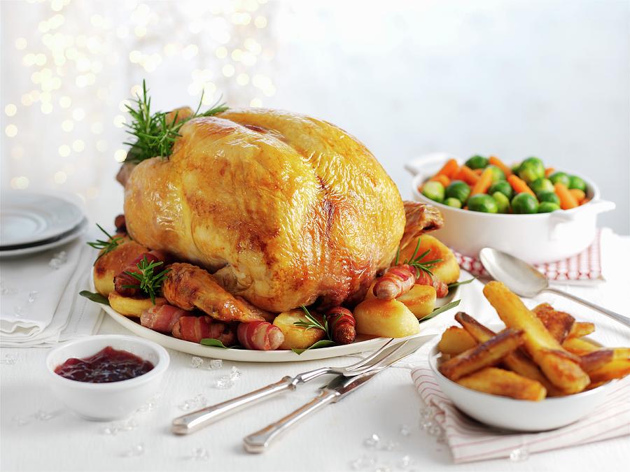 Traditional Roast Turkey With Roast Potatoes, Carrots And Sprouts christmas Photograph by Ian Garlick