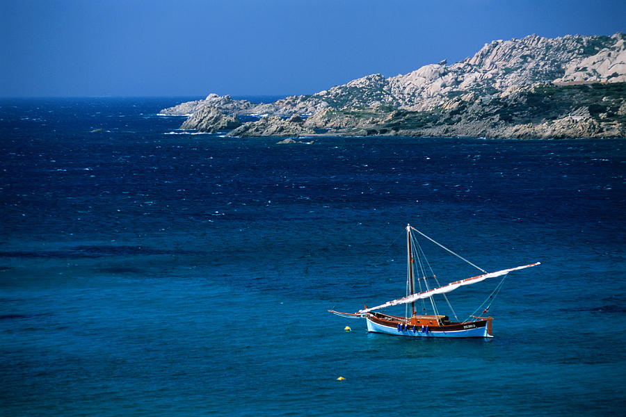 Traditional Sailboat On Rocky Coast Of Photograph by Dallas Stribley