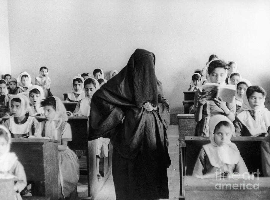 Traditionally-dressed Teacher In Class Photograph by Bettmann