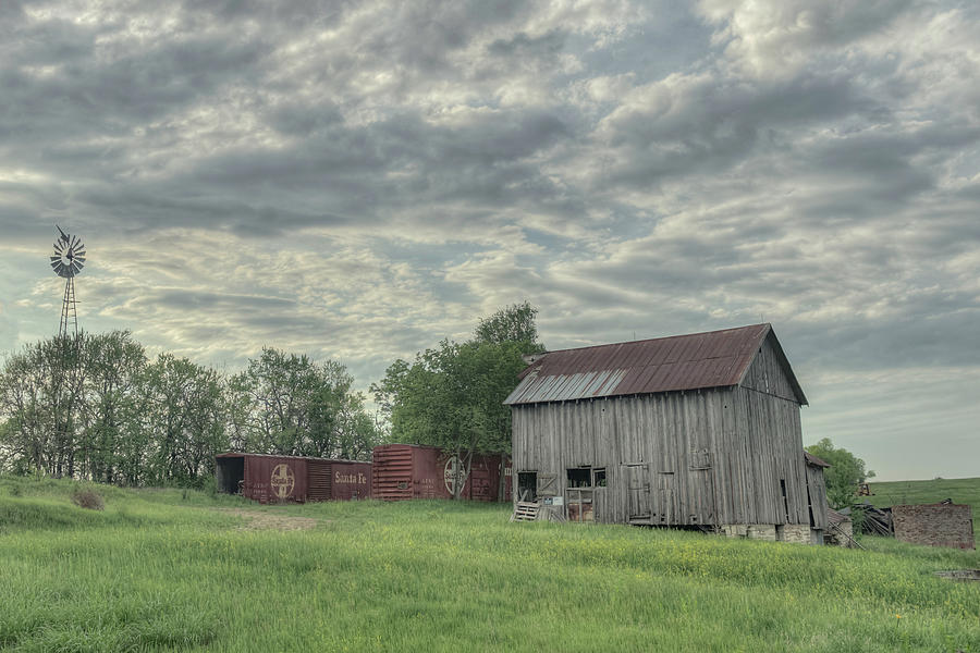 Train Cars and a Barn Photograph by Laura Hedien