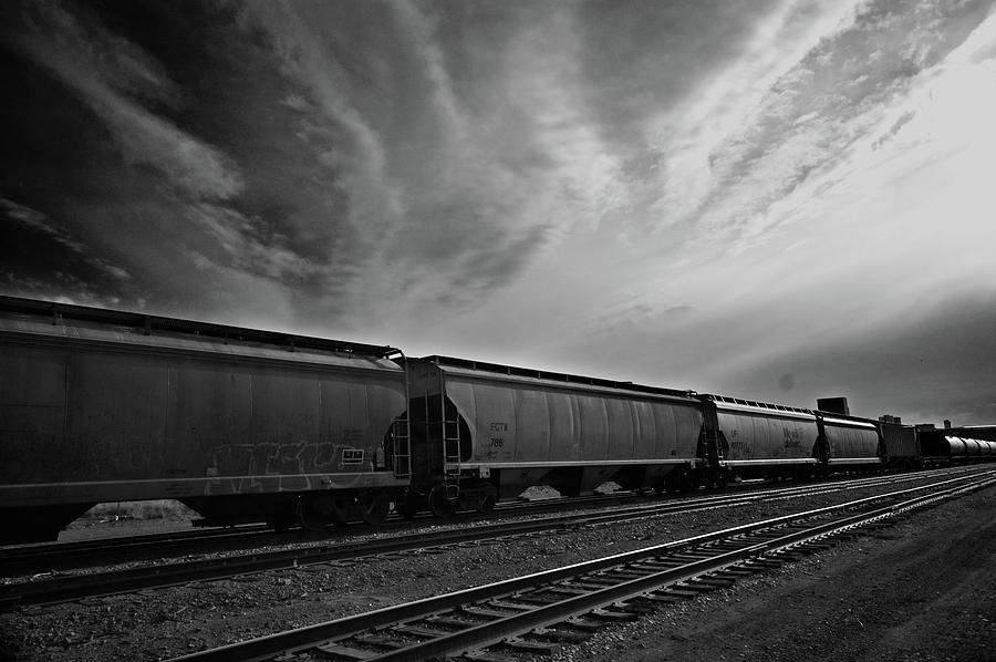 Train With Dramatic Clouds Photograph by Tara Camilli