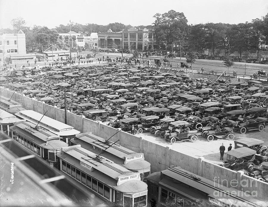 Trains Passing Parking Lot At Ball Photograph by Bettmann