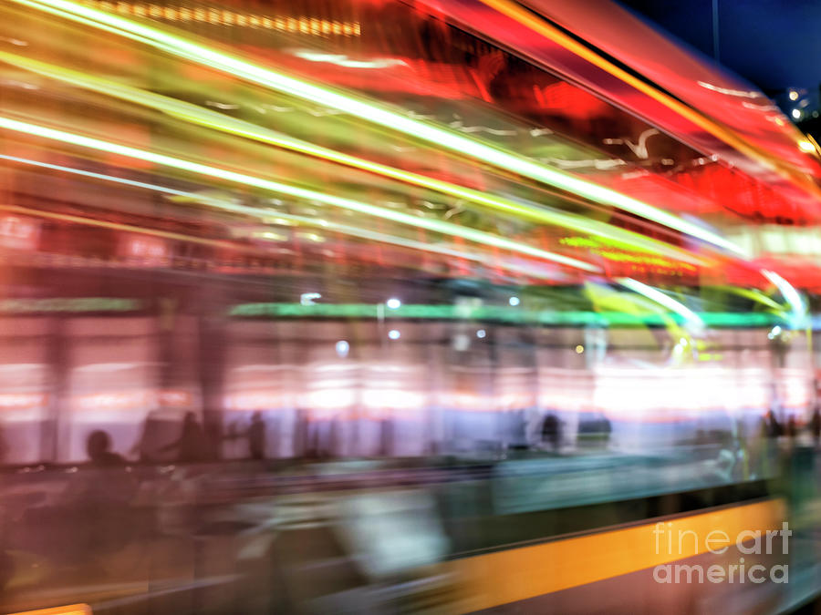 Tram Motion at Night in Dublin Photograph by John Rizzuto