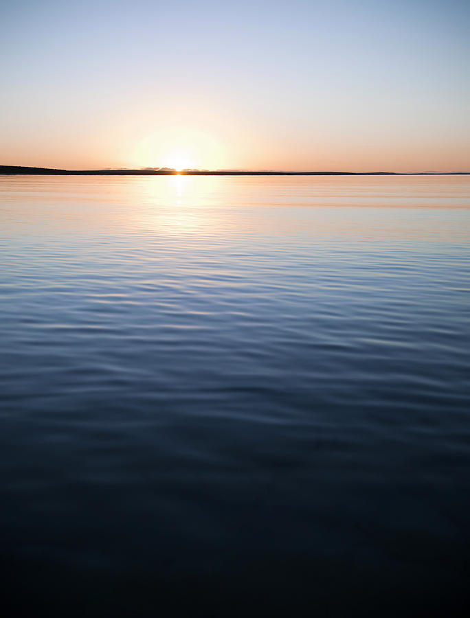 Tranquil Sunset Over Calm Water Photograph by Georgeclerk