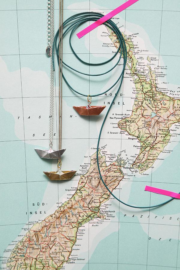 Travel Souvenirs: Ship Pendants Made From Paper And Beaten Metal Photograph by Thordis Rggeberg