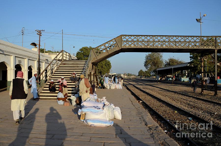 Travelers and traders wait with goods at train station platform Mirpurkhas Sindh Pakistan Photograph by Imran Ahmed