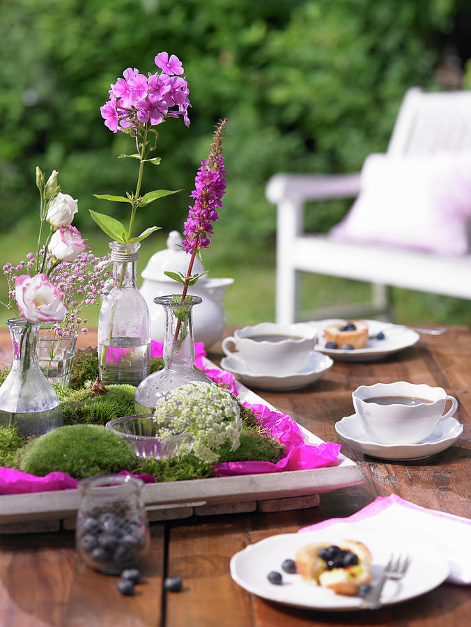 Tray Decorated With Moss And Flowers On Table Set For Afternoon Coffee In Garden Photograph by Viktor Wedel