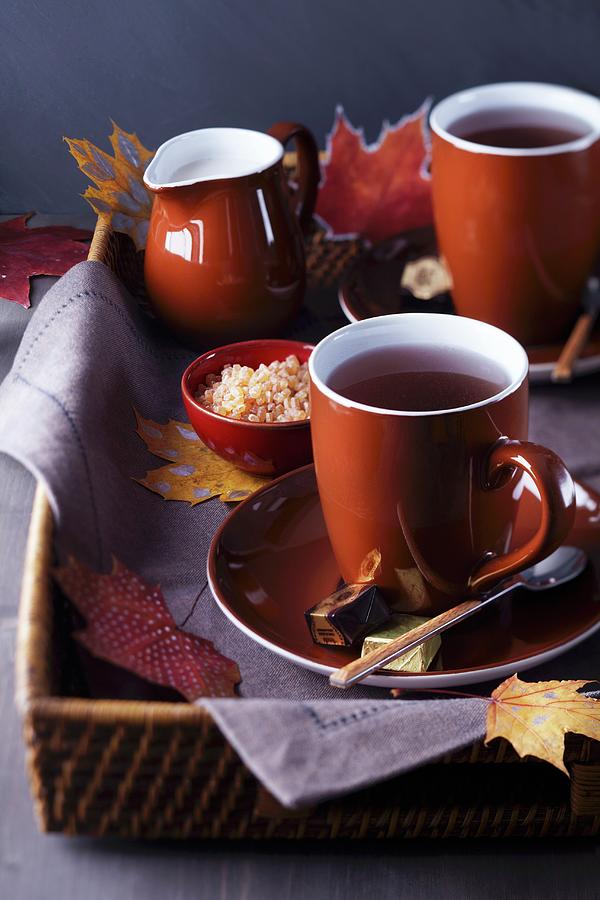 Tray Of Teacups, Sugar And Milk Decorated With Autumn Leaves Photograph by Franziska Taube