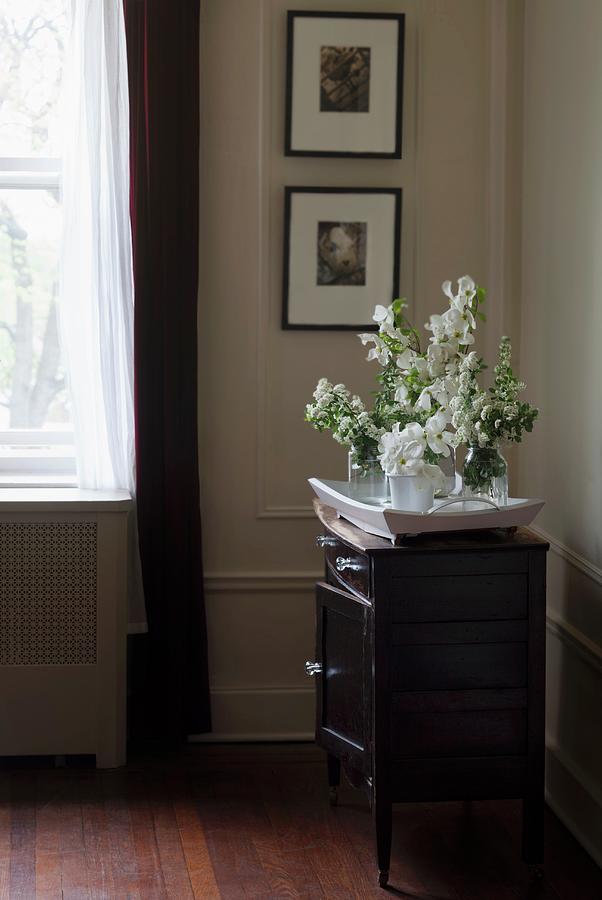 Tray Of White Flowers On Chest Of Drawers Photograph by Katharine Pollak