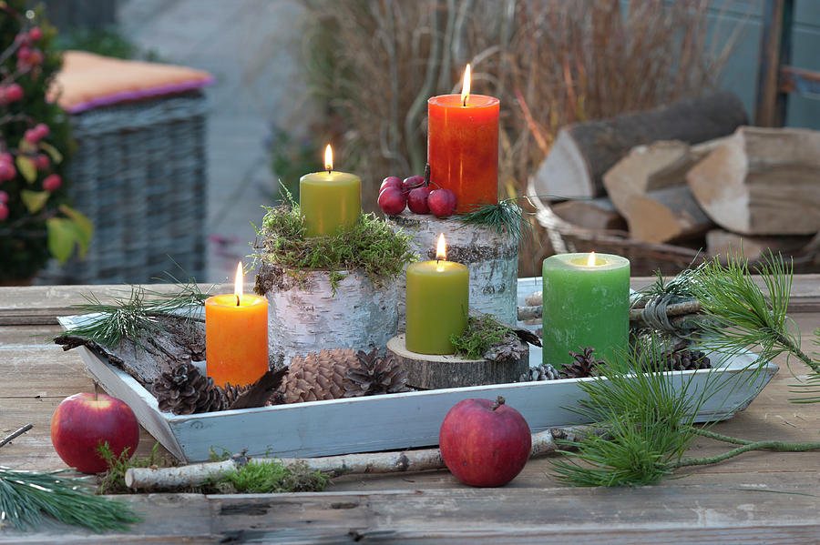 Tray With Candles On Little Pieces Of Trees Photograph by Friedrich Strauss