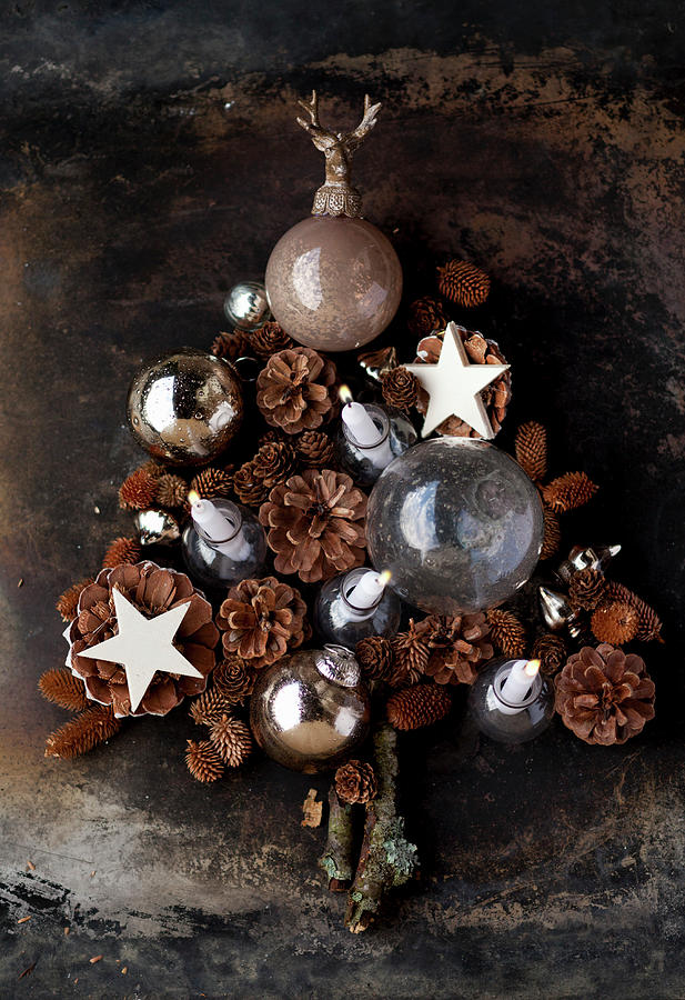 Tree-shaped Christmas Arrangement Of Baubles, Cones And Stars Photograph by Katrin Winner