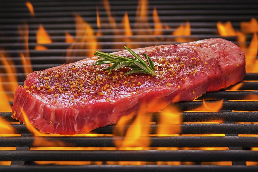 Tri Tip Steak With Rosemary And Spices On A Flaming Barbecue Photograph by Brian Enright