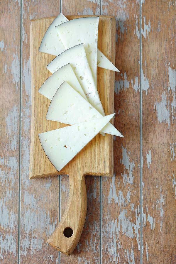 Triangles Of Manchego Cheese On A Chopping Board seen From Above Photograph by Rua Castilho