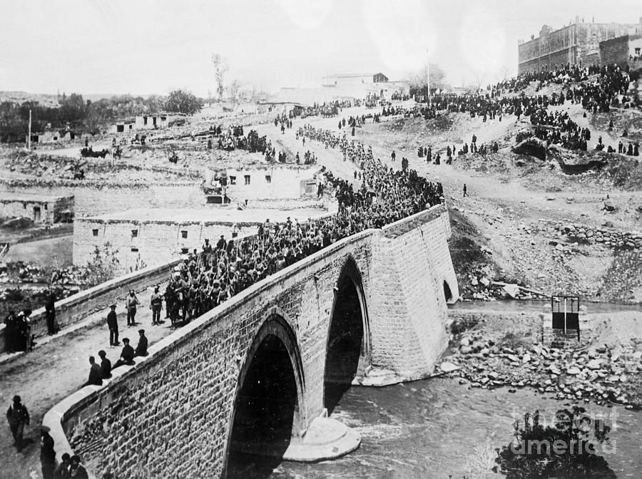 Troops March Across Bridge To Battle Photograph by Bettmann