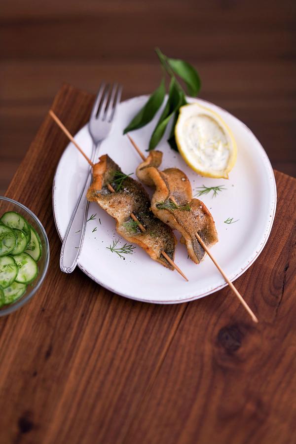 Trout Skewers With Cucumber Salad Photograph by Michael Wissing
