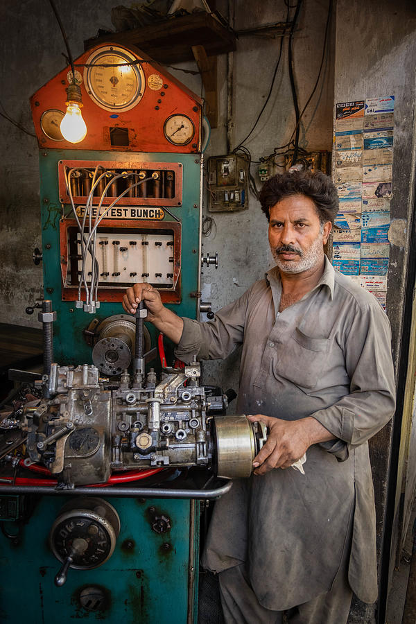 Truck Photograph - Truck Workshop In Rawalpindi, Pakistan by Raul Cacho Oses