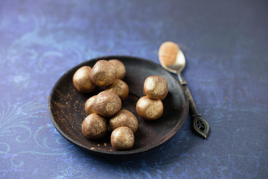 Truffle Pralines Rolled In Gold Powder Photograph by Mandy Reschke