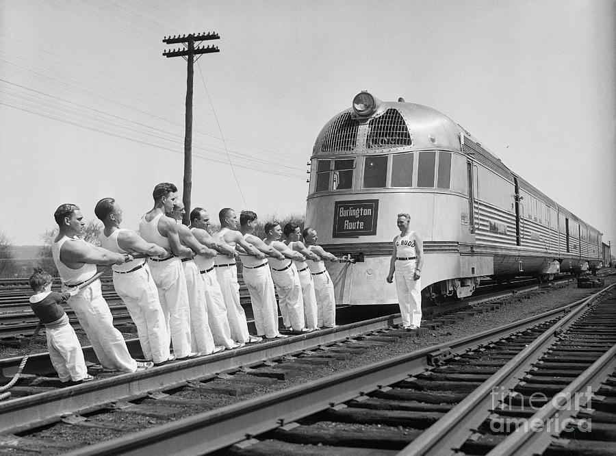 Tug-of-war Team Pulls Train Photograph by Bettmann
