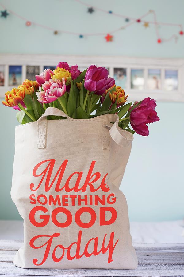 Tulips In Shopping Bag With Printed Motto Photograph by Tina Engel