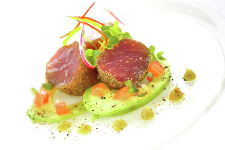 Tuna Fish Medallions With A Crumb Crust Served With Avocado, Tomatoes And Wasabi Sauce Photograph by Kaktusfactory