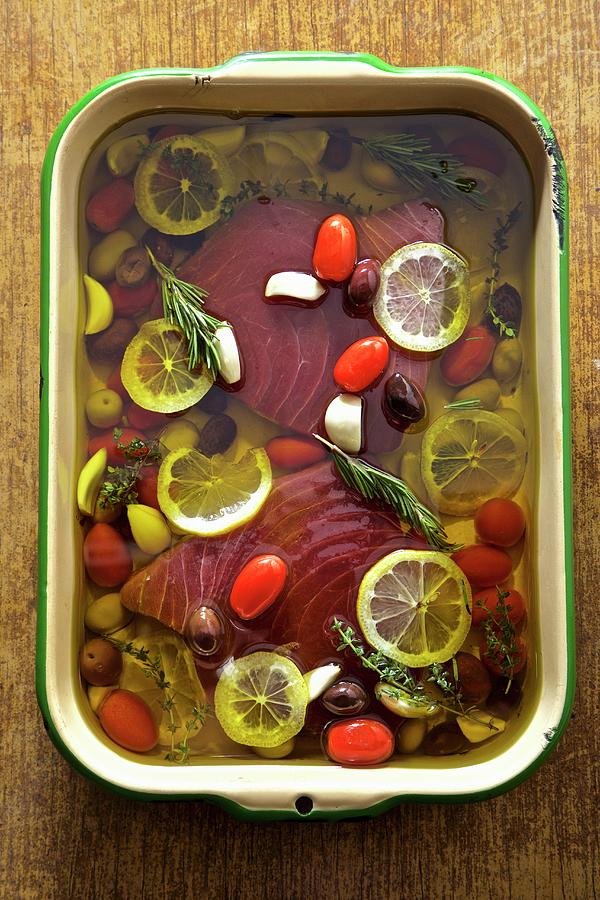 Tuna Poached In Olive Oil With Lemon, Garlic And Olives Photograph by Andre Baranowski