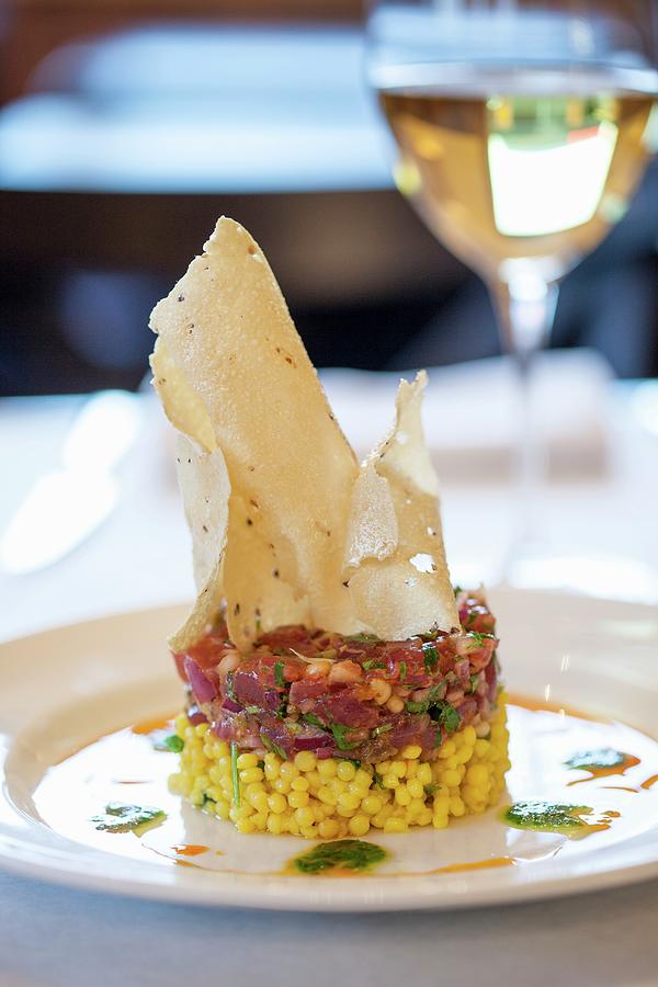 Tuna Tartar On A Bed Of Saffron Couscous With Green Olives Crispy Poppadoms Photograph by Gus Cantavero Photography
