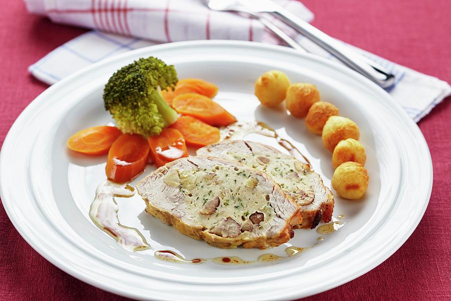 Turkey Breast With A Chestnut Filling And Potato Croquettes Photograph by Herbert Lehmann