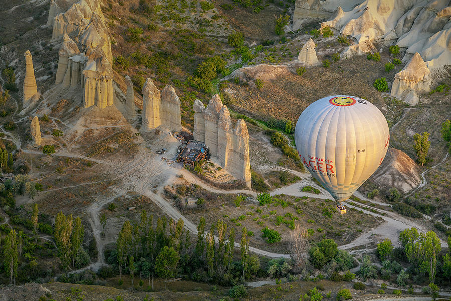 Turkey, Central Anatolia, Goreme, Cappadocia, Hot Air Balloon Flying Above The Fairy Chimneys Of Goreme National Park, Cappadocia Digital Art by Chantal Reed