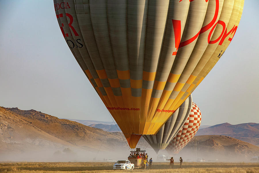 Turkey, Central Anatolia, Goreme, Cappadocia, Hot Air Balloon Landing On The Anatolian Plains, Cappadocia Digital Art by Chantal Reed