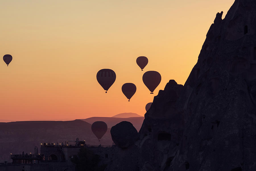 Turkey, Central Anatolia, Goreme, Cappadocia, Silhouettes Of Hot Air Balloons Flying At Dawn Over Goreme National Park, Cappadocia Digital Art by Chantal Reed