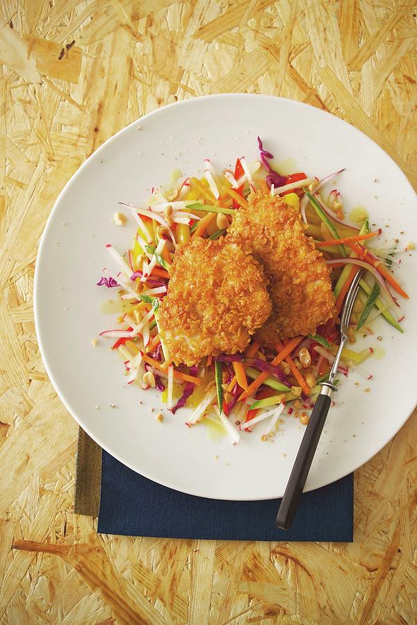 Turkey Escalope With A Cornflakes Coating Served With A Colourful Raw Vegetable Salad Photograph by Michael Wissing